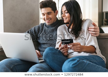 ストックフォト: Couple On Laptop Using Credit Card