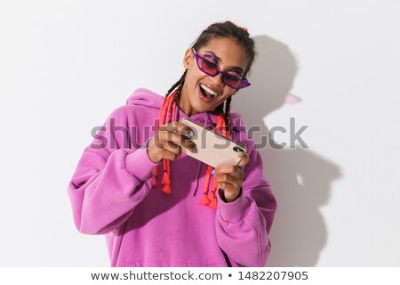 Foto stock: Emotional Young Women Friends Isolated Over Pink Wall Background Wearing Sunglasses