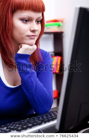 Stockfoto: Concentrated Red Haired Teenage Girl Studying