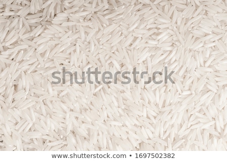 Foto d'archivio: White Bowl Of Raw Organic Basmati Rice On White Background Healthy Food