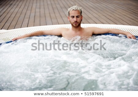 Foto stock: Young Man In Jacuzzi