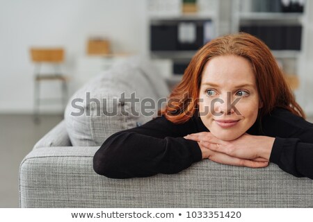 Foto stock: Young Fair Woman Resting Her Chin On Her Hands