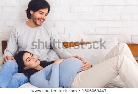 Stock photo: Pregnant Father Speaking With His Child In Stomach