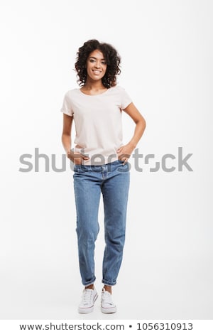 Foto d'archivio: Photo Of Gorgeous Curly Woman 20s Smiling At Camera Isolated Ov