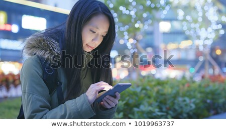 Zdjęcia stock: Young Business Woman Uses Cellphone At The Street