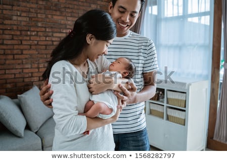 Stockfoto: Father With Little Baby Daughter At Home