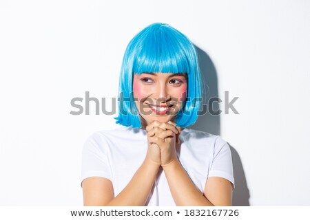 Foto stock: Image Of Asian Girl Wearing White Wig Smiling And Looking At Cop