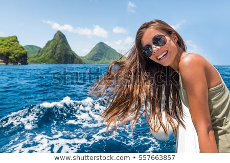 Foto stock: Happy Tourist Girl Having Fun On Boat Ride Towards The Deux Gros Pitons Famous Attraction In St Luc