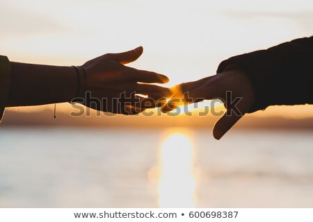 Stock fotó: Boy And Girl Hold Each Other For Hands