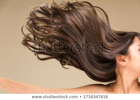 Zdjęcia stock: Beautiful Woman With Curly Hair Isolated On Beige