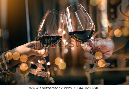 Сток-фото: Smiling Couple Toasting Wine Glass At The Table In Restaurant