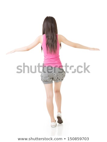 Stock photo: Young Asian Woman Walking On Imaginary Rope