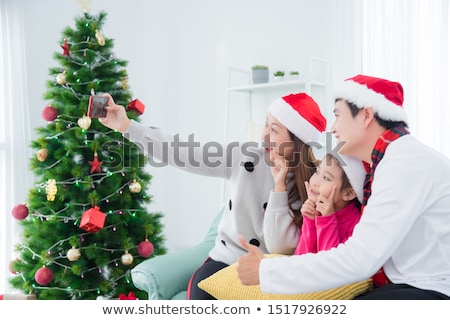 Stok fotoğraf: Family Taking A Selfie At Christmas Time