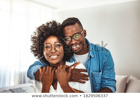 Foto stock: Couple Embracing Each Other At Counter