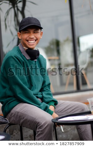 Stock photo: Fashion Model Sits And Smokes On The Side Of Road