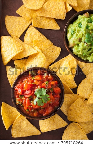 Foto stock: Guacamole With Tortilla Chips On The Wooden Tray