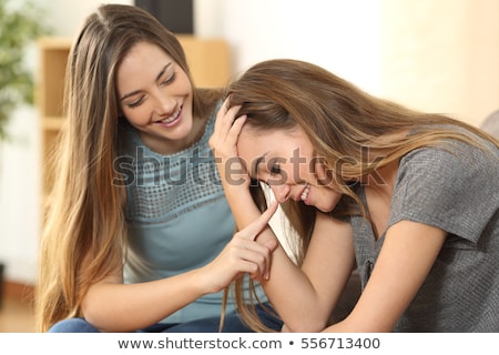 Stock photo: Young Woman Cheering Up Crying Female Friend