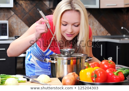 ストックフォト: Young Happiness Woman Cooking Vegetables Salad In The Kitchen H