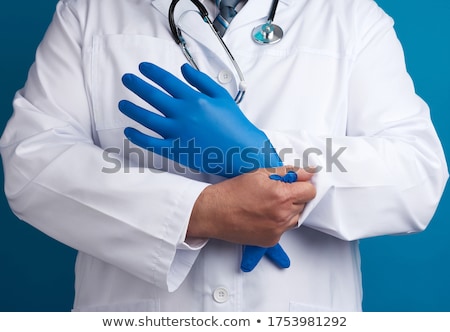Stock fotó: Close Up Of A Surgeon Putting On His Surgical Gloves