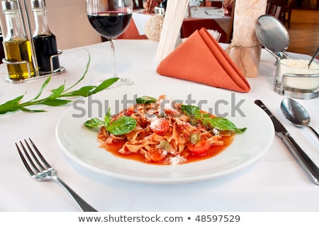 Closeup Of A Fituchini Served Up With Sauce And Cherry Tomatoes Foto stock © luckyraccoon