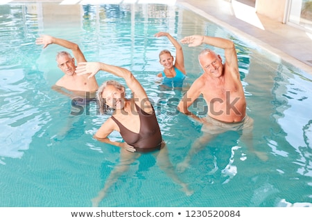 Foto d'archivio: Senior In Water Gymnastics Therapy