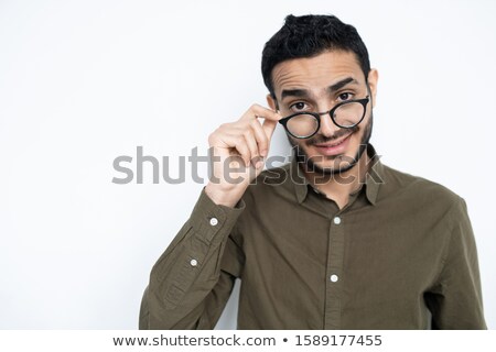Stock photo: Casual Man Taking Off His Shirt While Looking At You