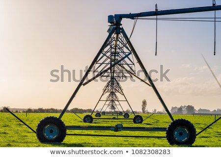 Foto stock: Automated Farming Irrigation System In Sunset