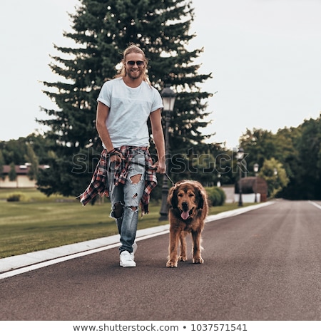 [[stock_photo]]: Young Man Spending A Relaxing Day With His Dog