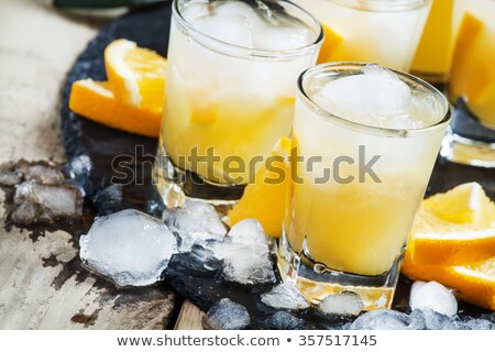 Stock fotó: An Orange Soft Drink With Ice Cubes In A Pitcher