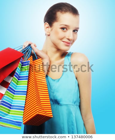 Foto stock: Portrait Of Stunning Young Woman Carrying Shopping Bags