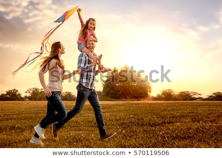 Foto stock: Happy Young Family With Daughter On Beach In Summer