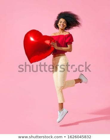 [[stock_photo]]: African American Woman With Heart Shaped Balloon