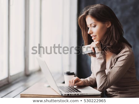 Foto stock: Woman Shopping Online Laptop Credit Card