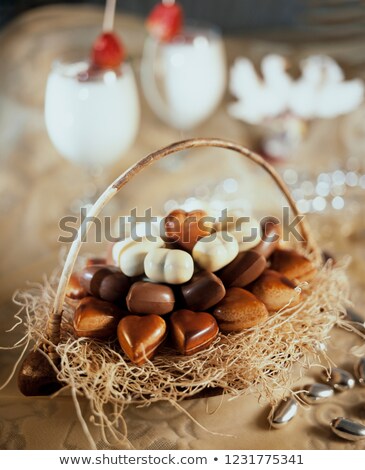 Stok fotoğraf: Two Chocolate Candies And Hearts