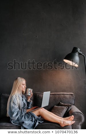 Stock photo: Young Sexy Woman Smiling On A Couch