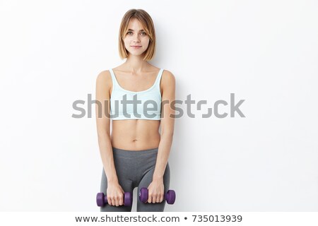 Stock photo: Beautiful Woman Bodybuilder Posing Against White Background