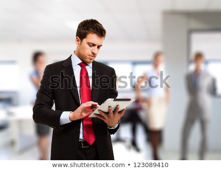 Stok fotoğraf: Handsome Man Using His Tablet Computer
