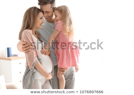 [[stock_photo]]: Pregnant Mother And Her Husband On Baby Room