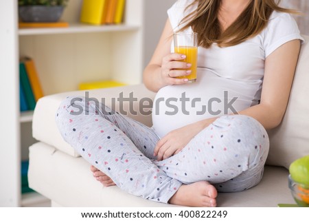 Сток-фото: Pregnant Young Woman Drinking Fresh Water At Home