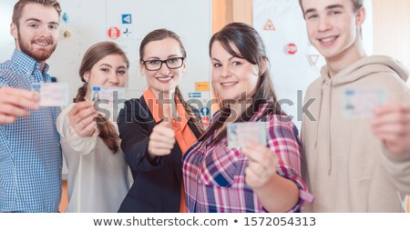 Stock fotó: Driving Instructor And Students Showing Their New Licenses