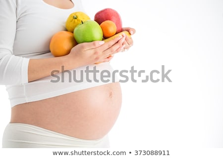 Stockfoto: Heathy Food For My Baby Pregnant Woman Holding A Plate With Fruits Nutritional Needs During Pregna