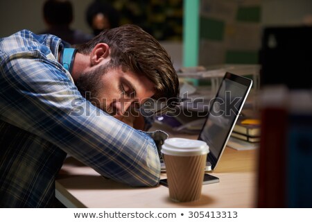 Foto stock: Female Worker Asleep At Desk