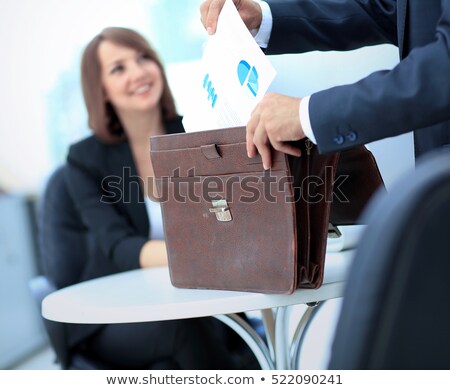 Zdjęcia stock: Businesswoman Getting Documents Out Of A Briefcase
