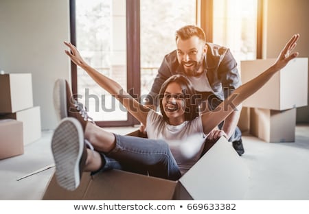 Stock foto: Young Beautiful Woman Moving In A New Home