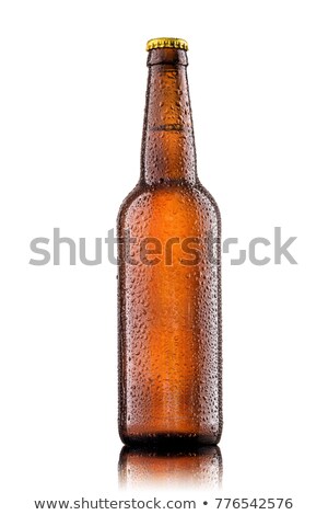 Foto d'archivio: Beer Bottle With Water Drops And Frost Isolated On White