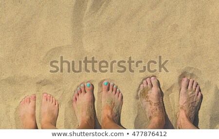 Foto stock: Feet Of A Family In The Fine Sand Of The Beached Grouped In A C