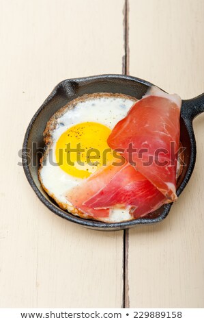 Egg Sunny Side Up With Italian Speck Ham Foto stock © keko64