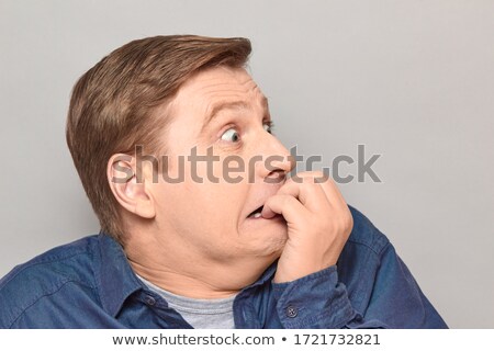 [[stock_photo]]: Horrible Background With Eyes And A Frightened Man