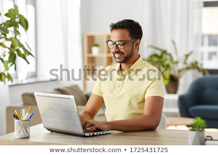 ストックフォト: Man Working On Laptop From Home