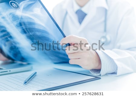 Foto stock: Young Male Doctor Radiologist Working At The Clinic